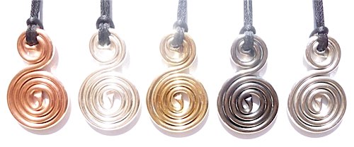 PHI Spiral Harmoniser pendants, copper then from left silver, gold, ruthenium and rhodium plated over copper. A small phi of copper tubing becomes a large PHI below. Tubing contains high implosion energy water makes a small phi on top  becomes large PHI 
